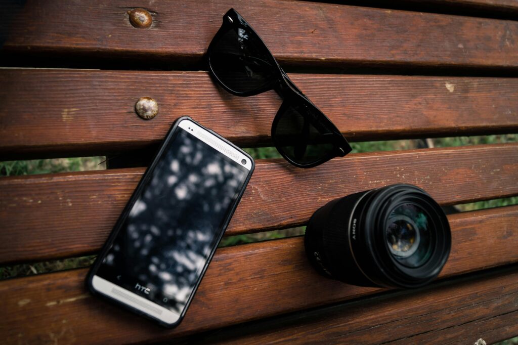 https://www.pexels.com/photo/black-wayfarer-sunglasses-near-the-camera-lens-165927/