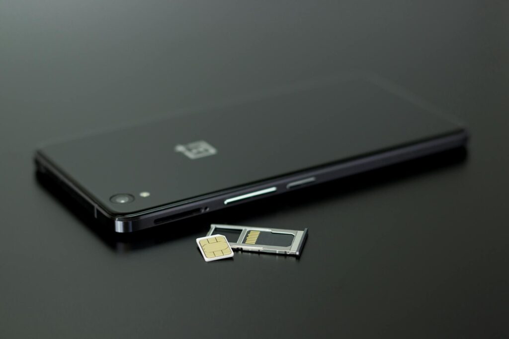 https://www.pexels.com/photo/black-smartphone-on-black-table-top-63690/
