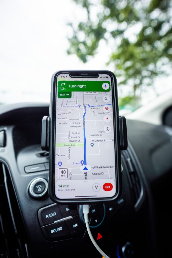 https://www.pexels.com/photo/cellphone-on-a-stand-with-navigation-map-application-open-7738879/
